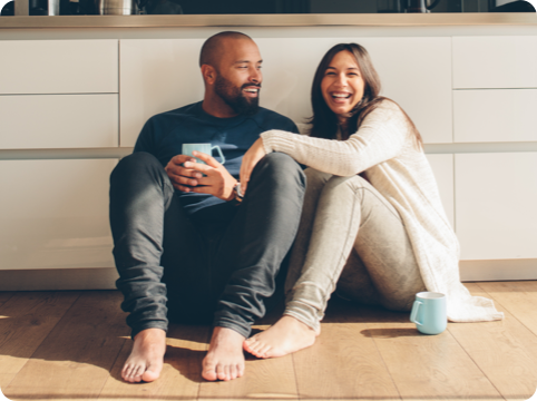 Man and woman sitting on a floor together