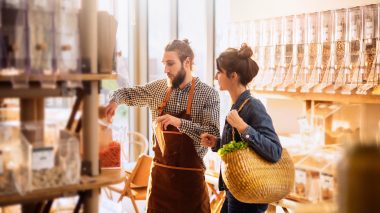 A store associate helping a woman in a store