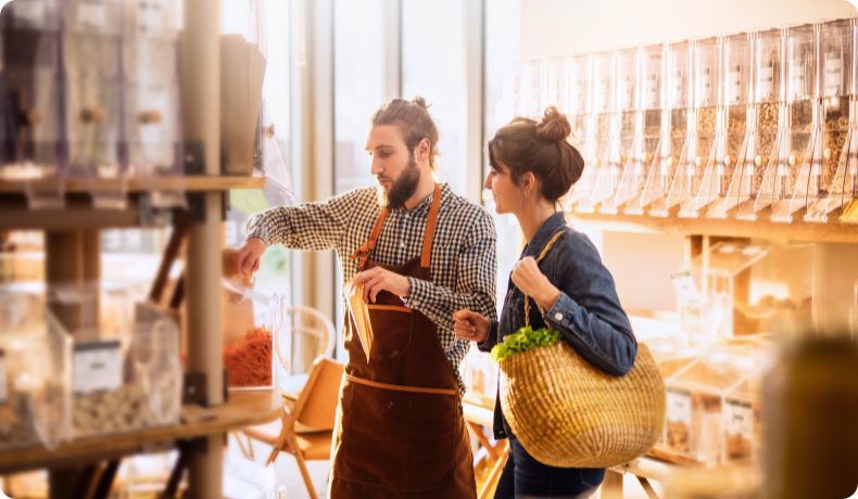 A woman and store associate in a business