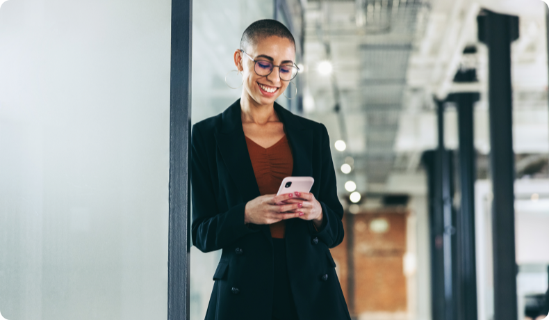 Woman smiling looking at phone