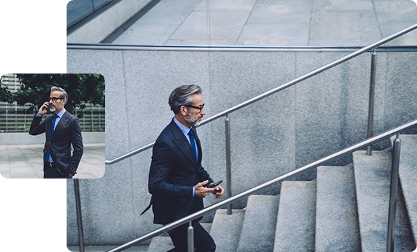 Businessman walking up stairs, businessman talking on phone