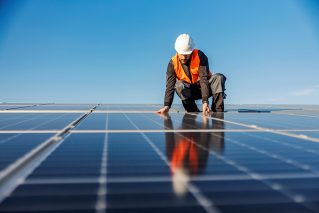 Portrait of construction worker maintaining solar panels