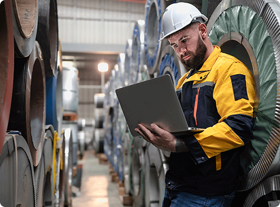 Manufacturing worker on laptop