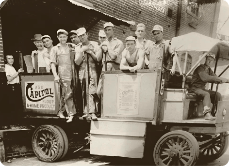 Early employees of Capitol Food Co pose for a picture